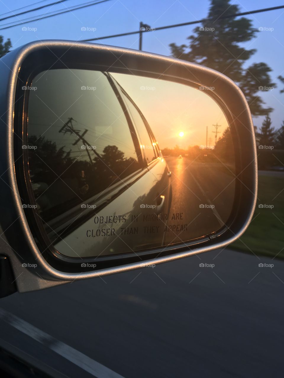 Sun in a car ride mirror 
