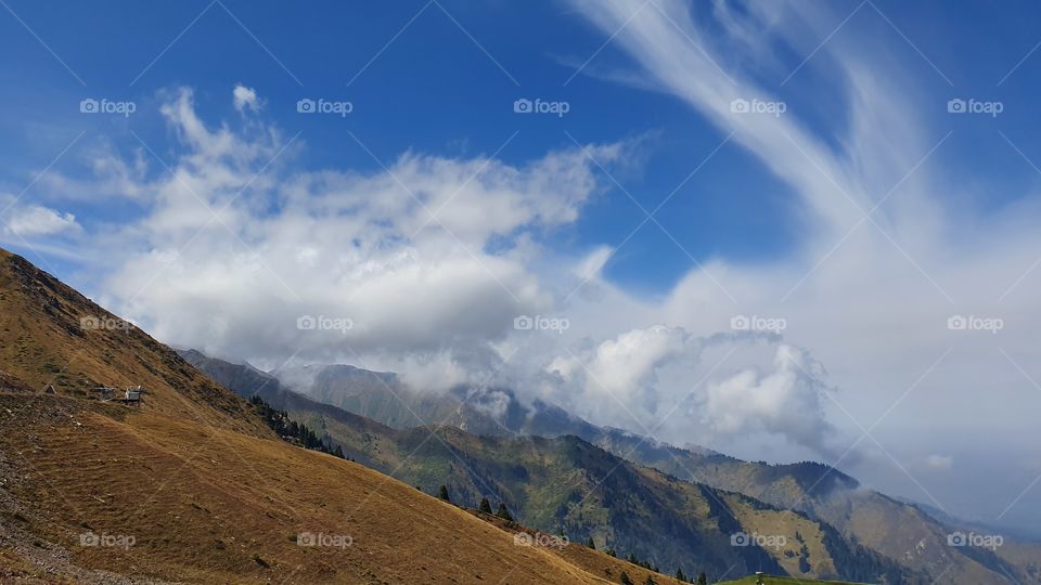 Almaty mountains peaks and clouds