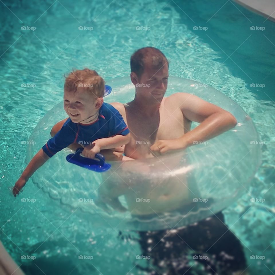 father and son summer fun swimming