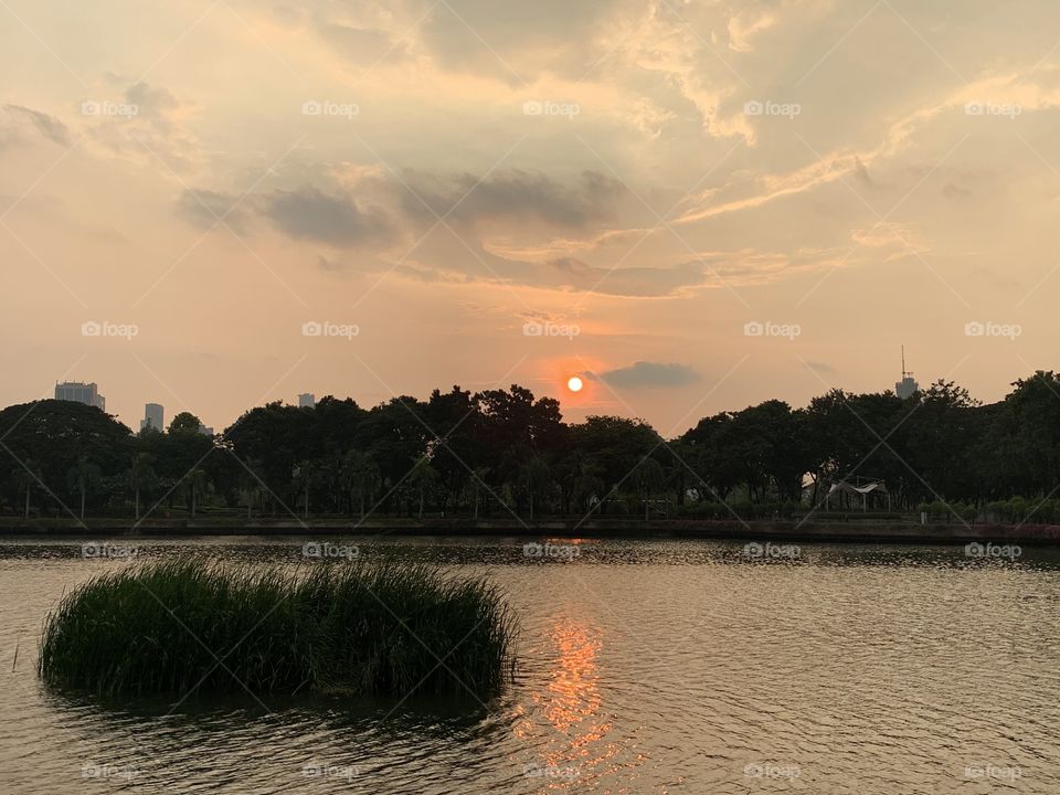 Sunset in Benjakiti Park in Bangkok Thailand 