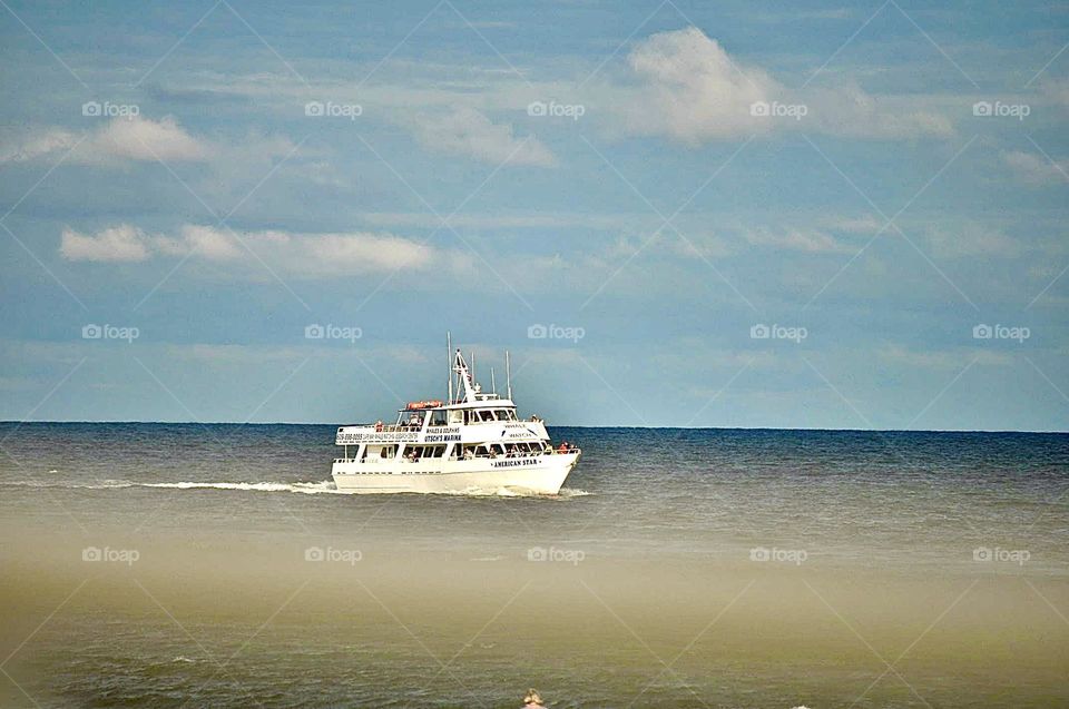 Ship sailing in beach.