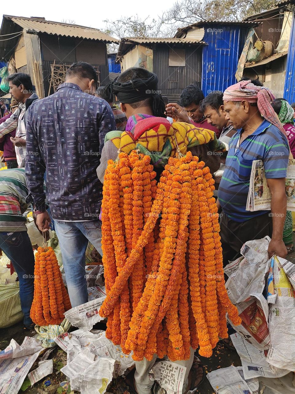 Man collecting flowers at a flower market to sell