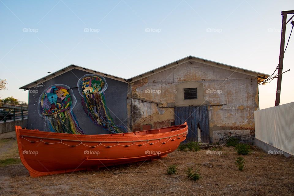 The old boat, orange boat, sunset