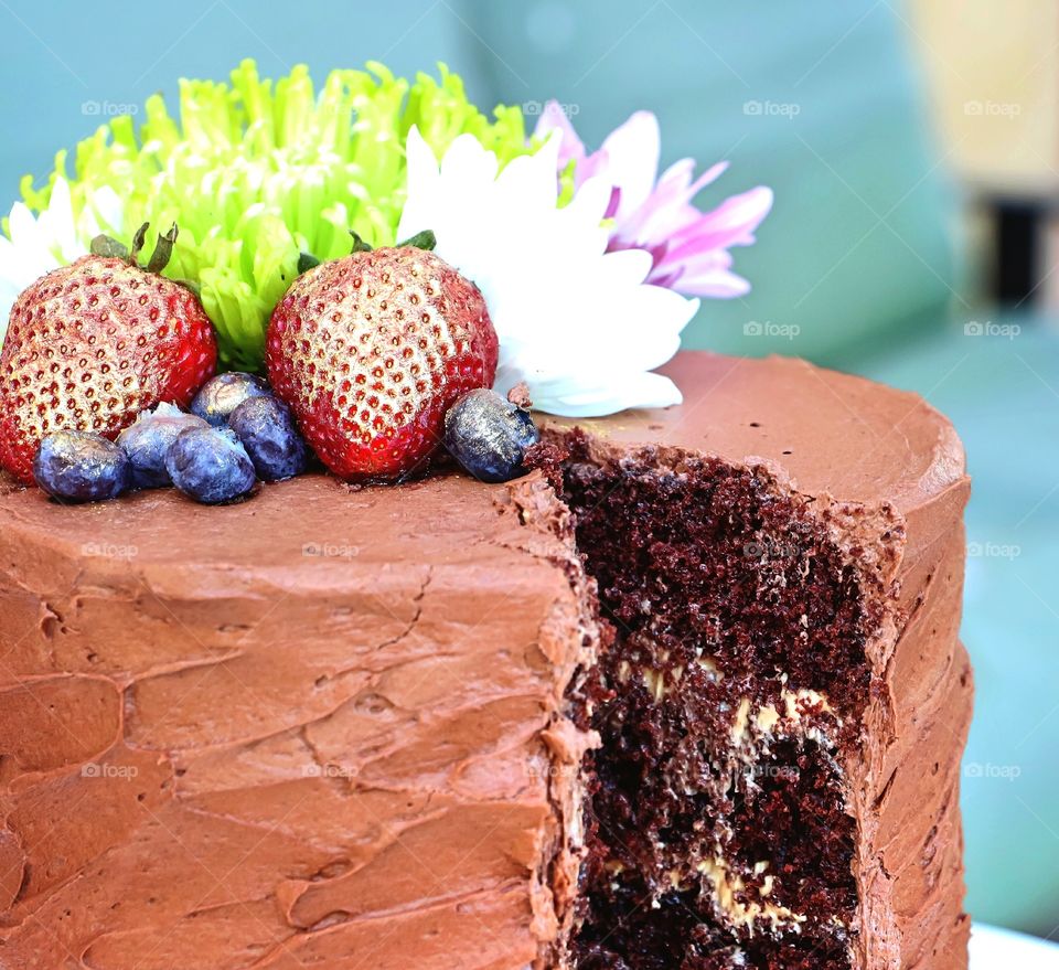 Flowers and fruits on cake