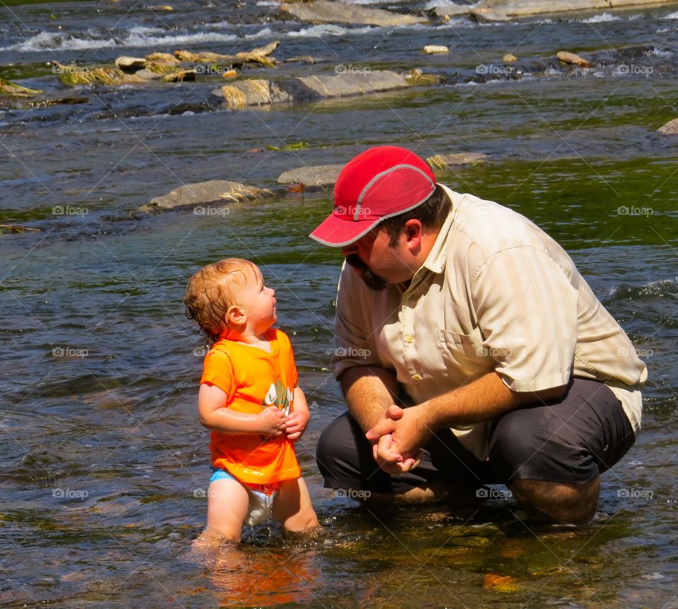 Father with daughter in sea