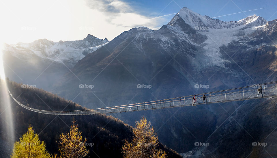 Longest suspended bridge ever made in Zermatt, Switzerland. From fall to winter concept.