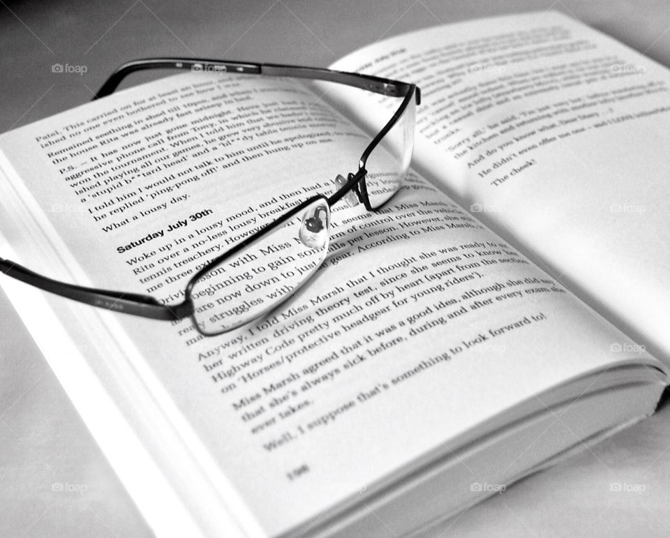 Reading glasses and novel. 