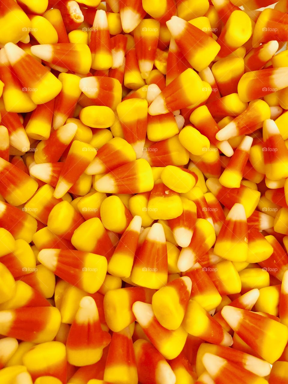 🧡Colorful candycorn with brilliant shades of yellow, orange, and white. It doesn't have to be Halloween to enjoy this sugary treat!🧡
