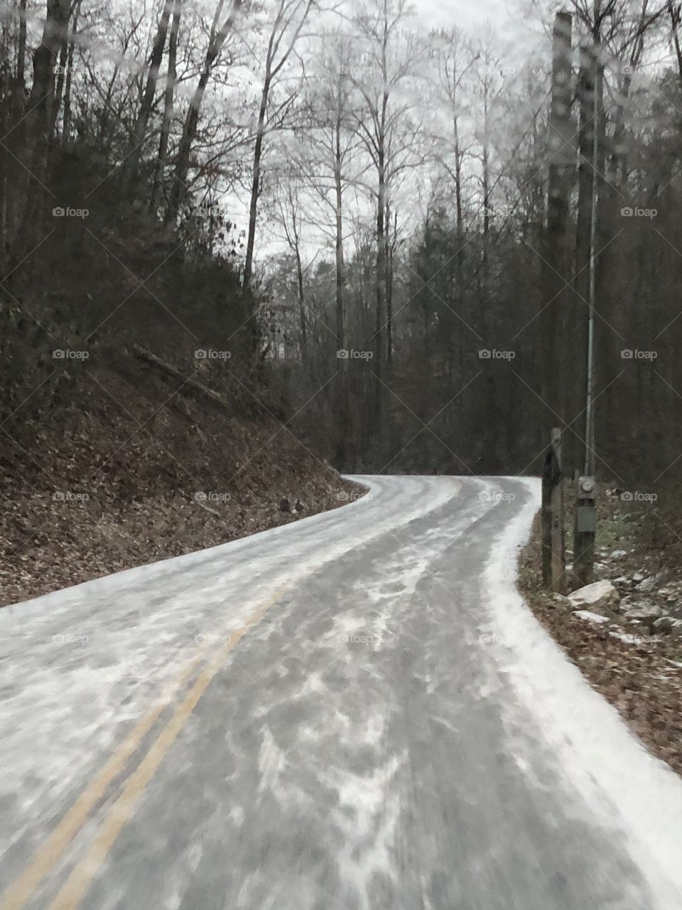 Road on a light snowy day in the mountains 