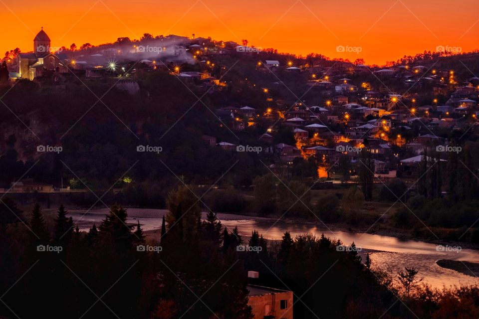 Silhouette house light scape on beautiful twilight background at Kutaisi Georgia 