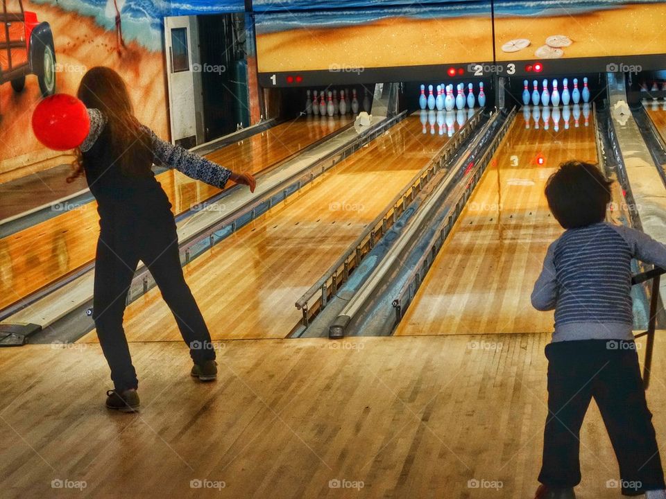 Children At A Bowling Alley. American Bowling Alley
