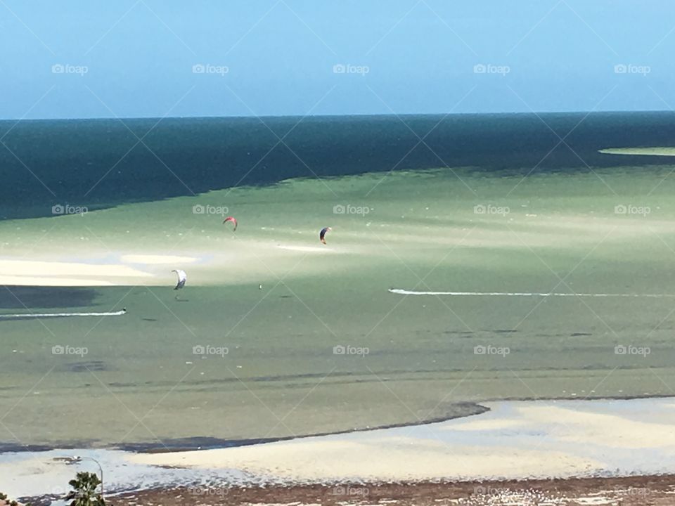 Kite boarders on white sand beach south Australia 