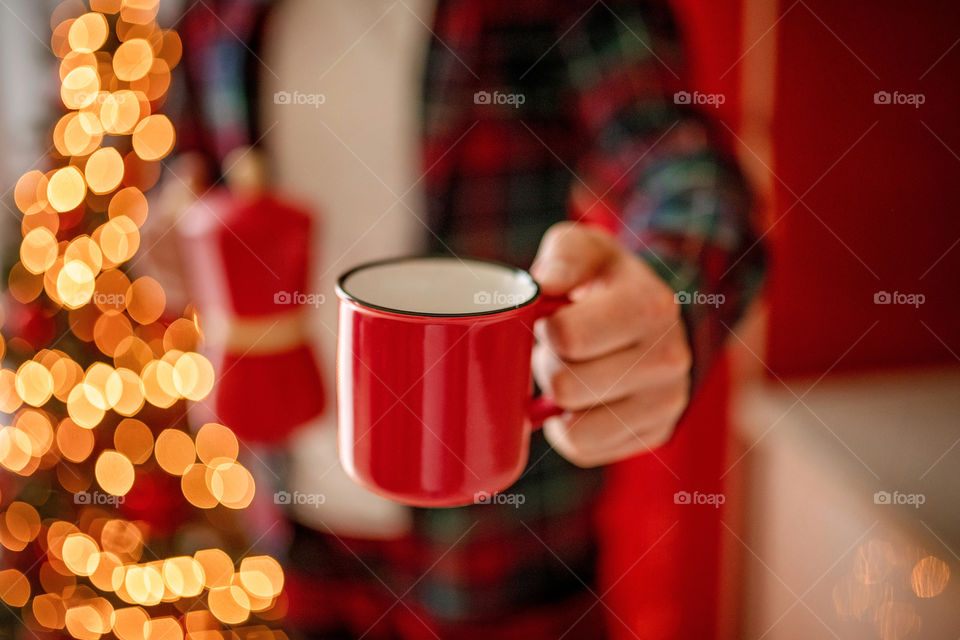 cup of coffee in a cozy festive Christmas atmosphere