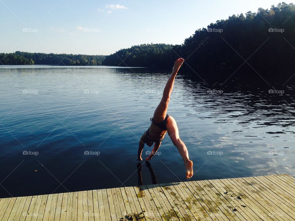 Taking a dip in the lake. A friend of mine diving in the cold Swedish waters 