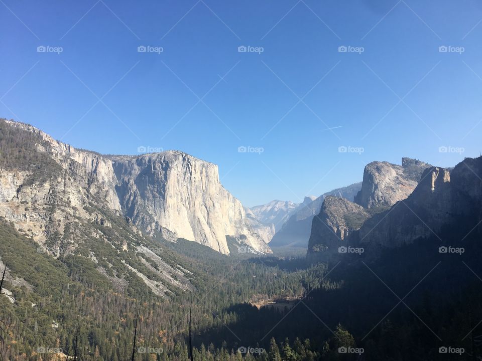 Yosemite Valley view of El Capitan Mountain where the valley is clear and there are no clouds. 
