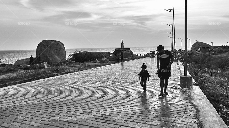 A fathers memory - walking along the shoreline with his kiddo 