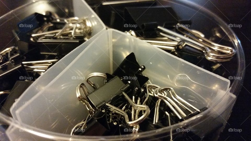 binder clips. a container or binder clips