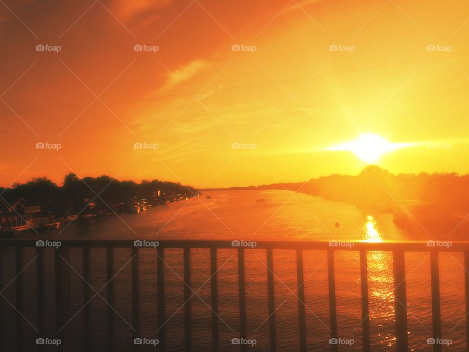 amazing sunset, river and bridge
