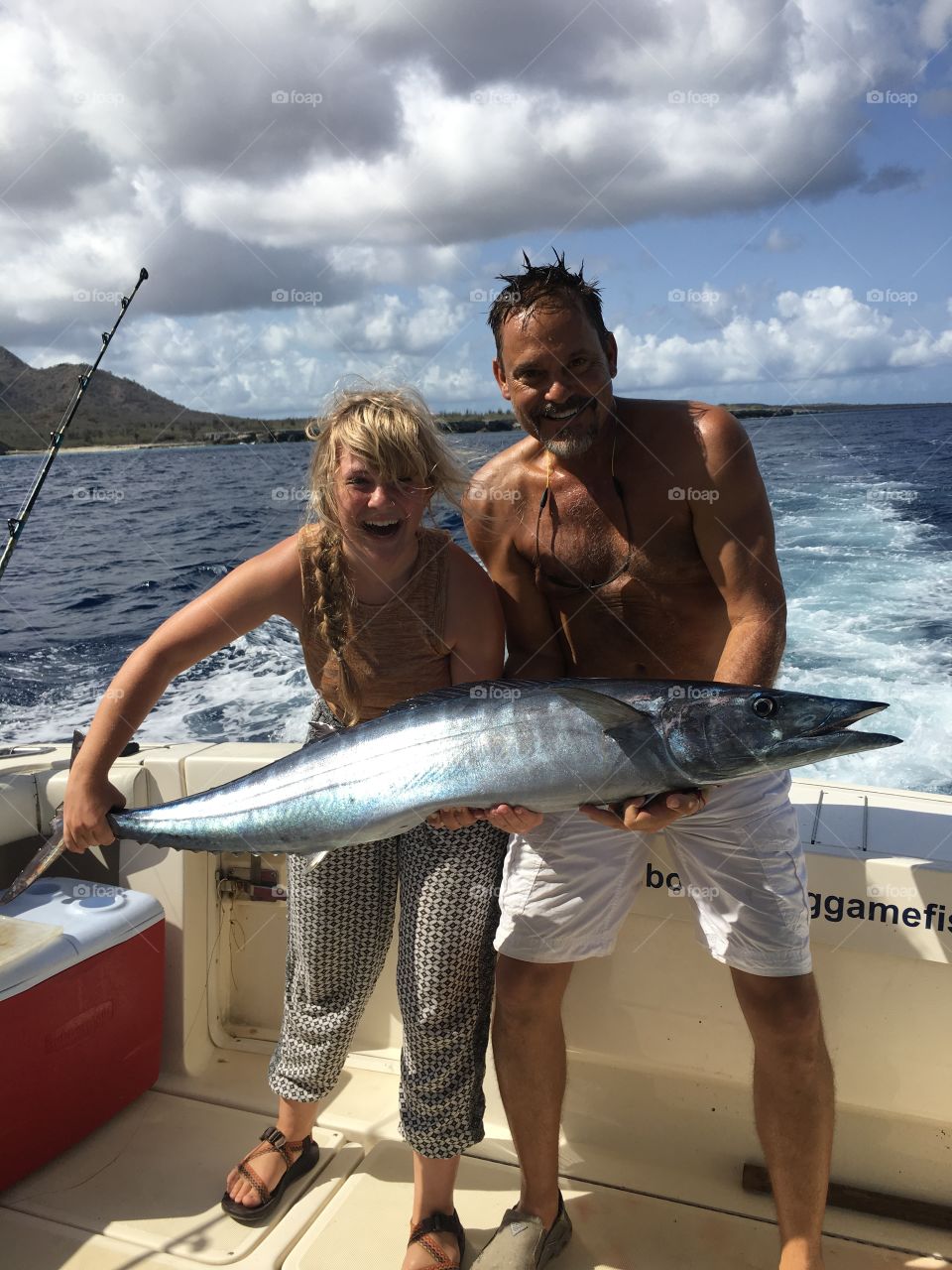 We caught the big one. A huge catch off the shore of Bonaire. Big smiles, hair blowing in the wind, and sunshine all around 