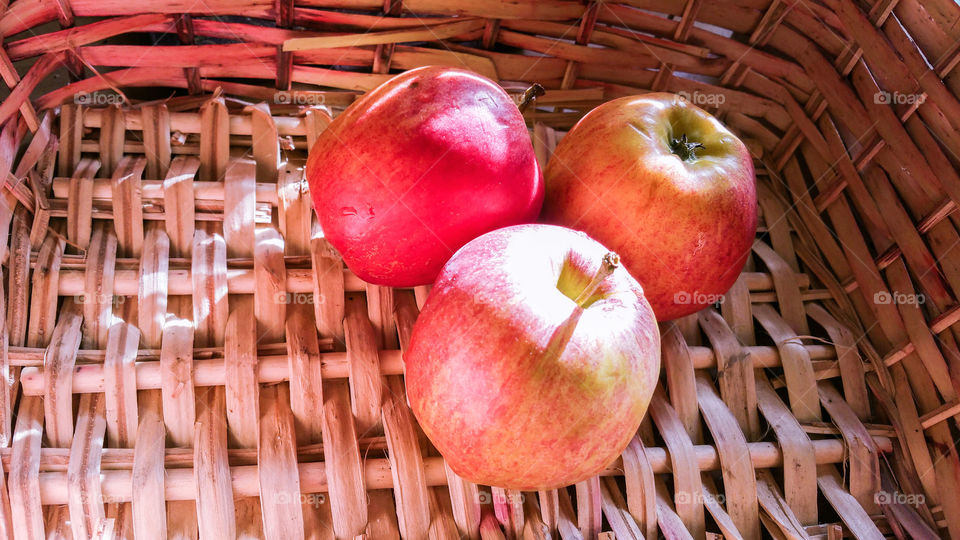 Pink apples in a basket