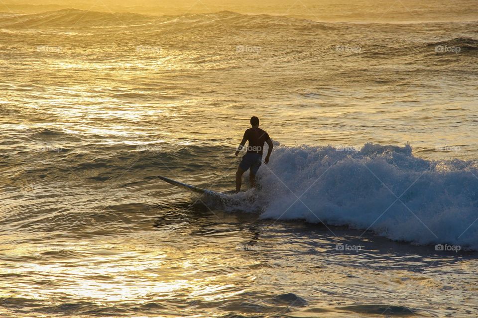 Surfing at sunset 