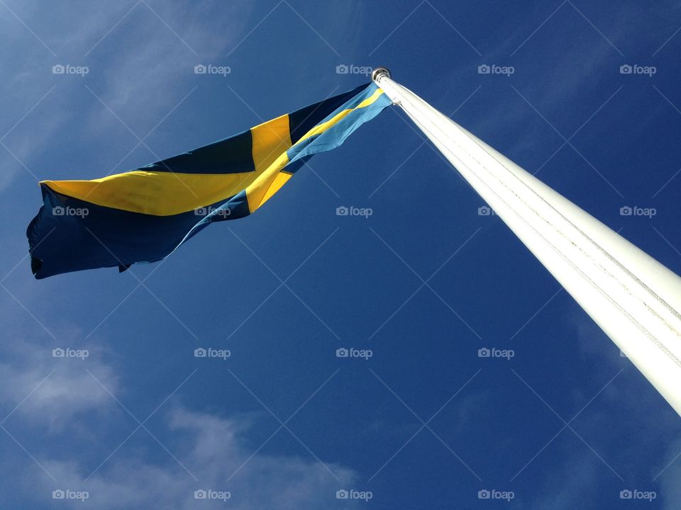 Sweden. Looking up on a Swedish flag