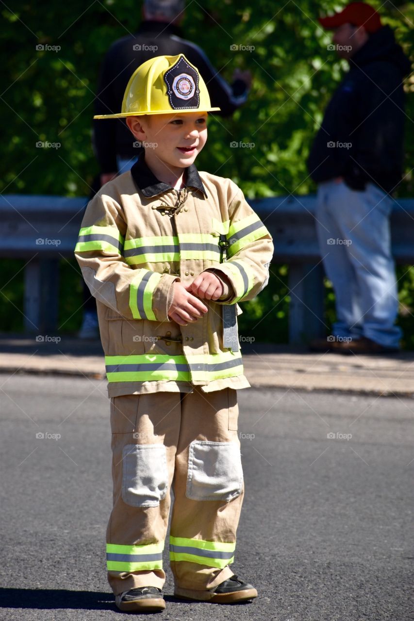 Little Fireman. This picture of this child was taken at a parade where Michelle dressed up as his father who is in the parade.