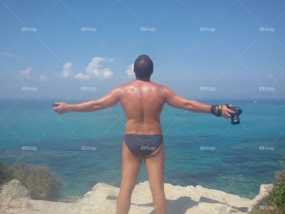 Man with nikon on the beach