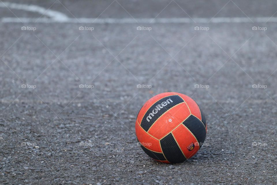 Close up view of a ball on the ground with nobody around it 