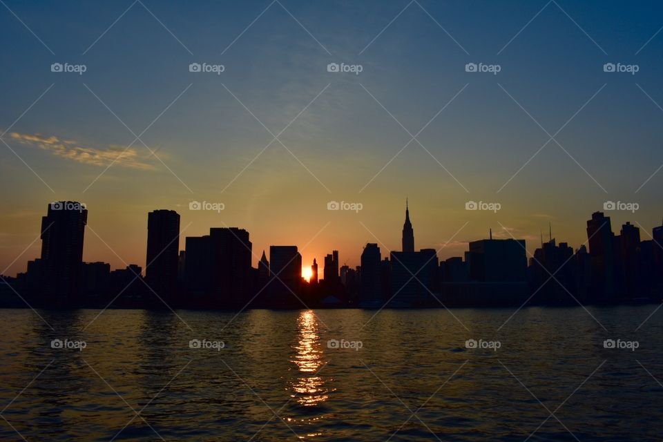 New York skyline and sunset view behind is breathtaking  