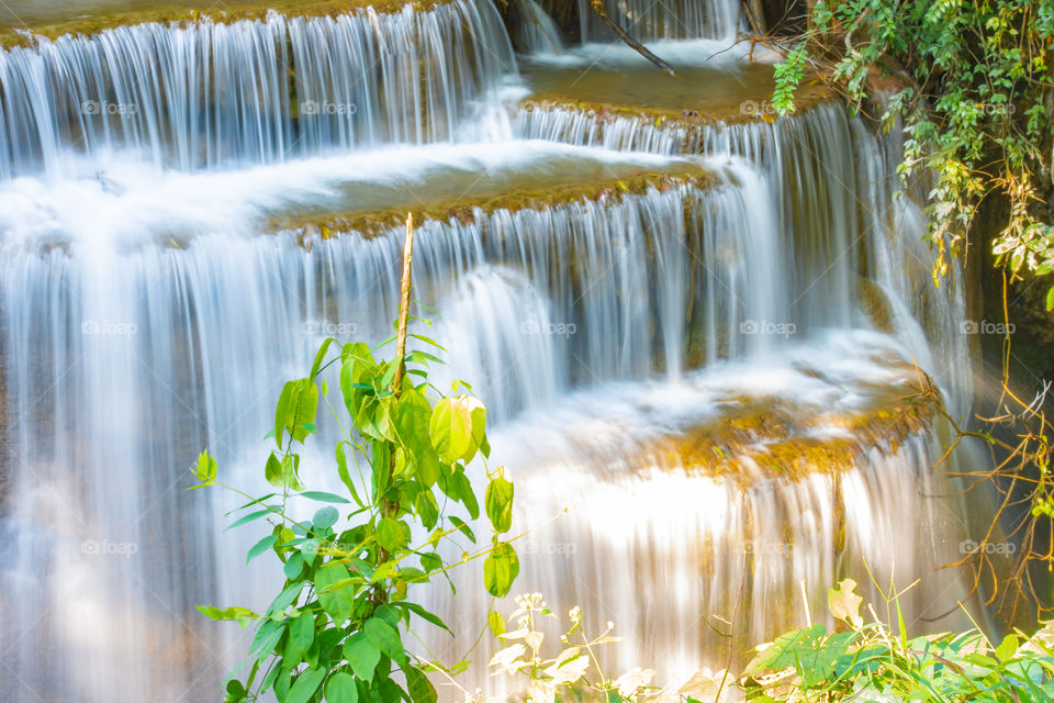 Waterfall flowing from the mountains at Huay Mae khamin waterfall National Park ,Kanchana buri in Thailand.