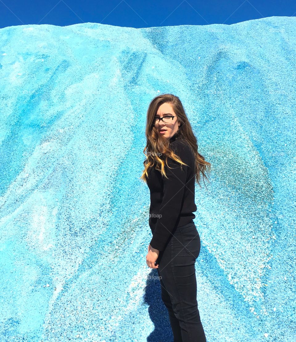 Model in front of blue salt rocks 
