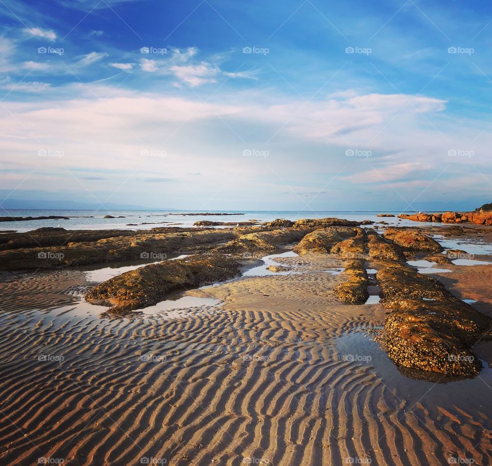 Ripples in the sand low tide rock pools