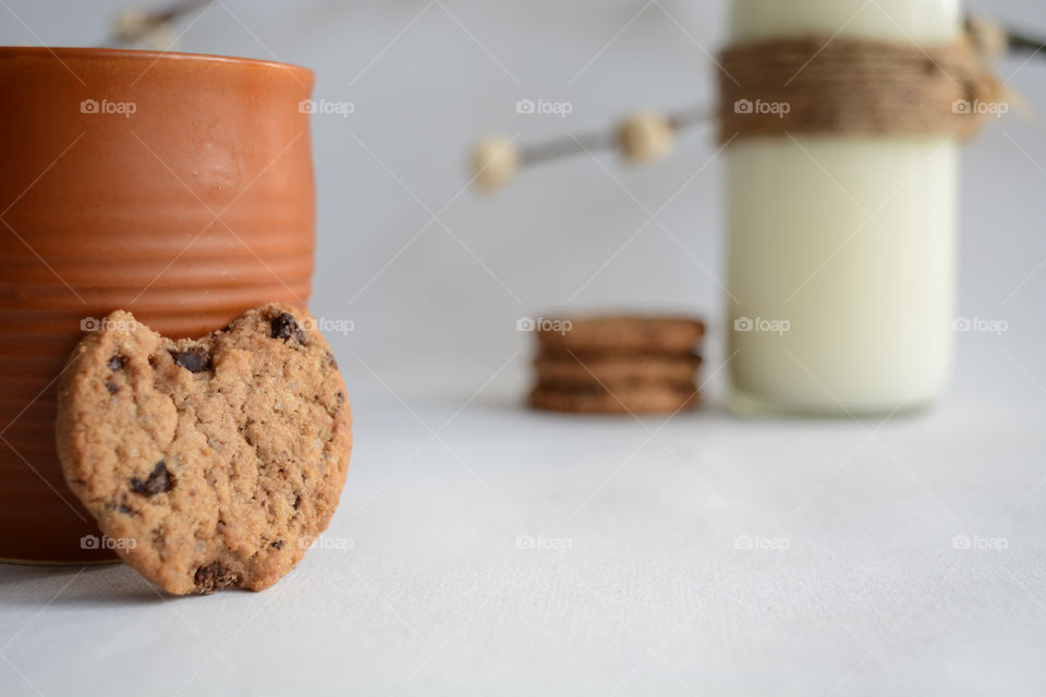 Chocochip cookies with bottle of milk