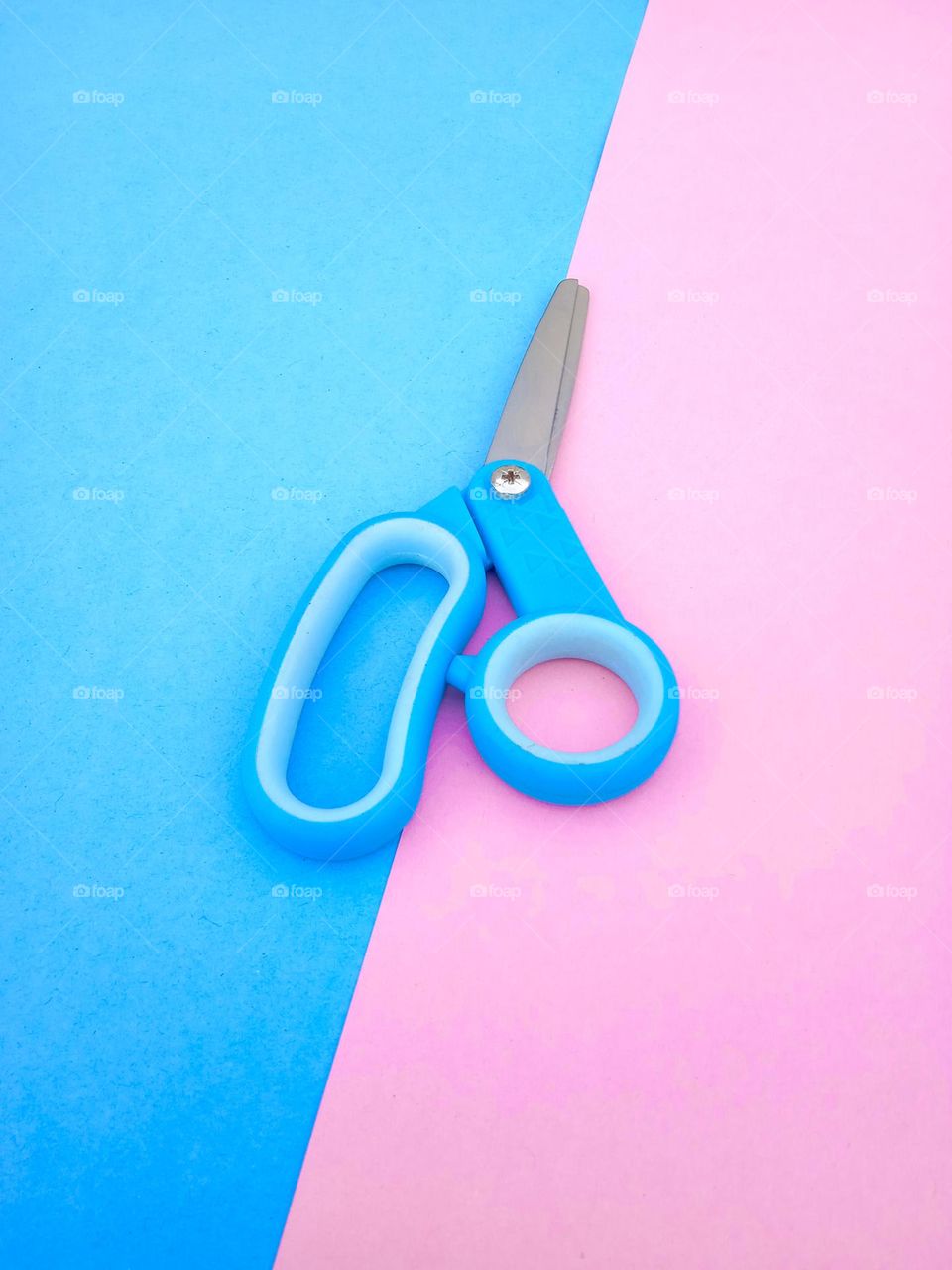 scissors between blue and pink