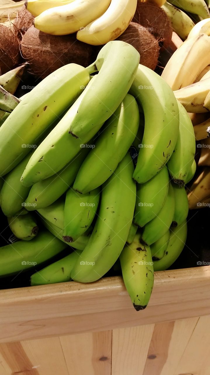 Stack of bananas and coconuts