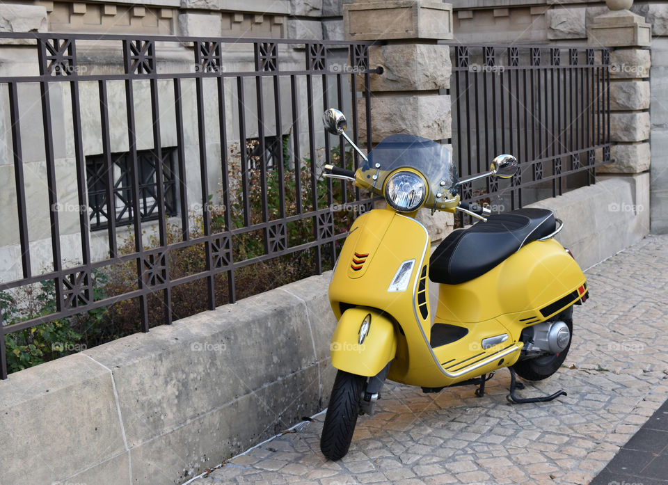 yellow motorcycle in the city.