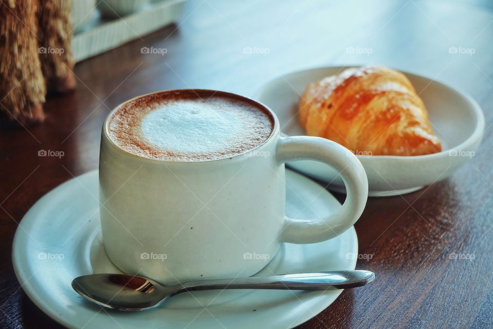 Coffee cup hot and croissant 