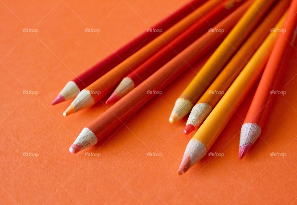 Orange Color Story - colored pencils in various sham Des of orange on an orange background 