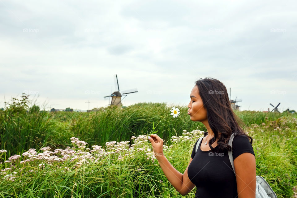 Woman smelling flower in springtime