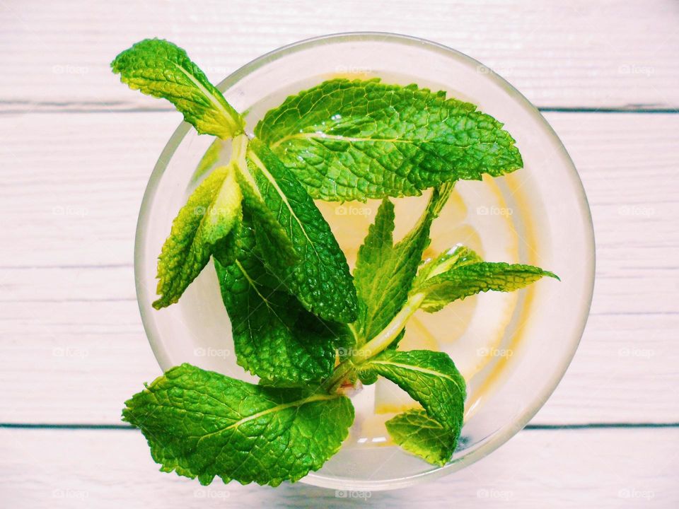 Lemonade with lemon and mint leaves