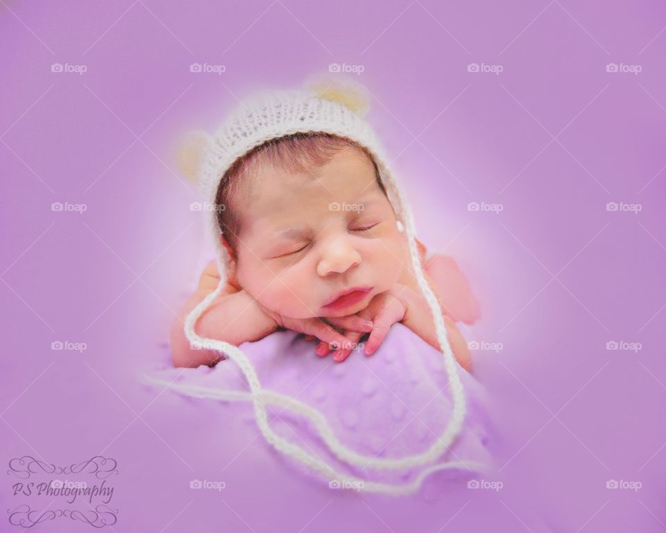 Newborn with bear cap