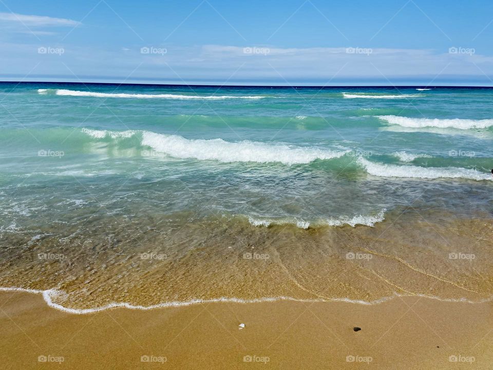 Blue waters on a Lake Huron Sandy beach in Northern Michigan