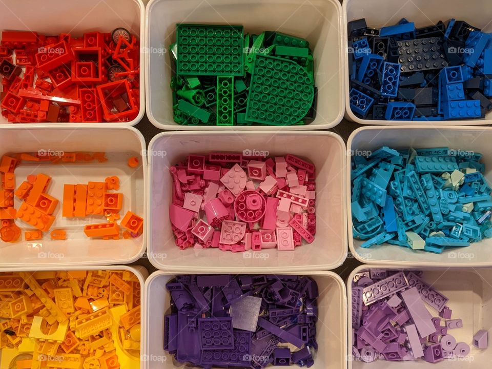 boxes of Lego blocks sorted by colour.