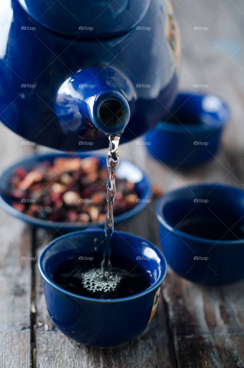 Pouring tea in cup