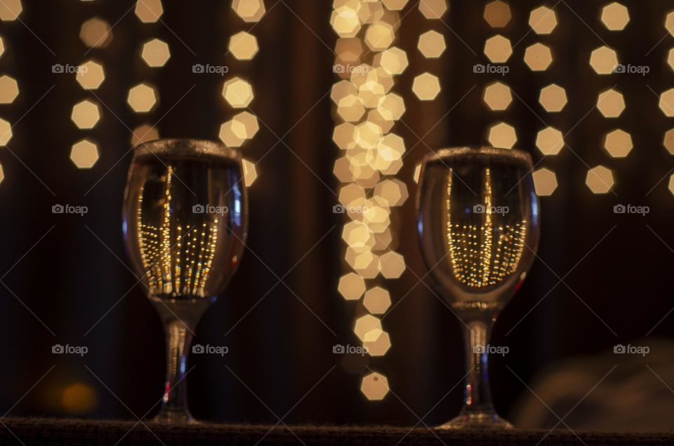 Bokeh lights through shampagne glass