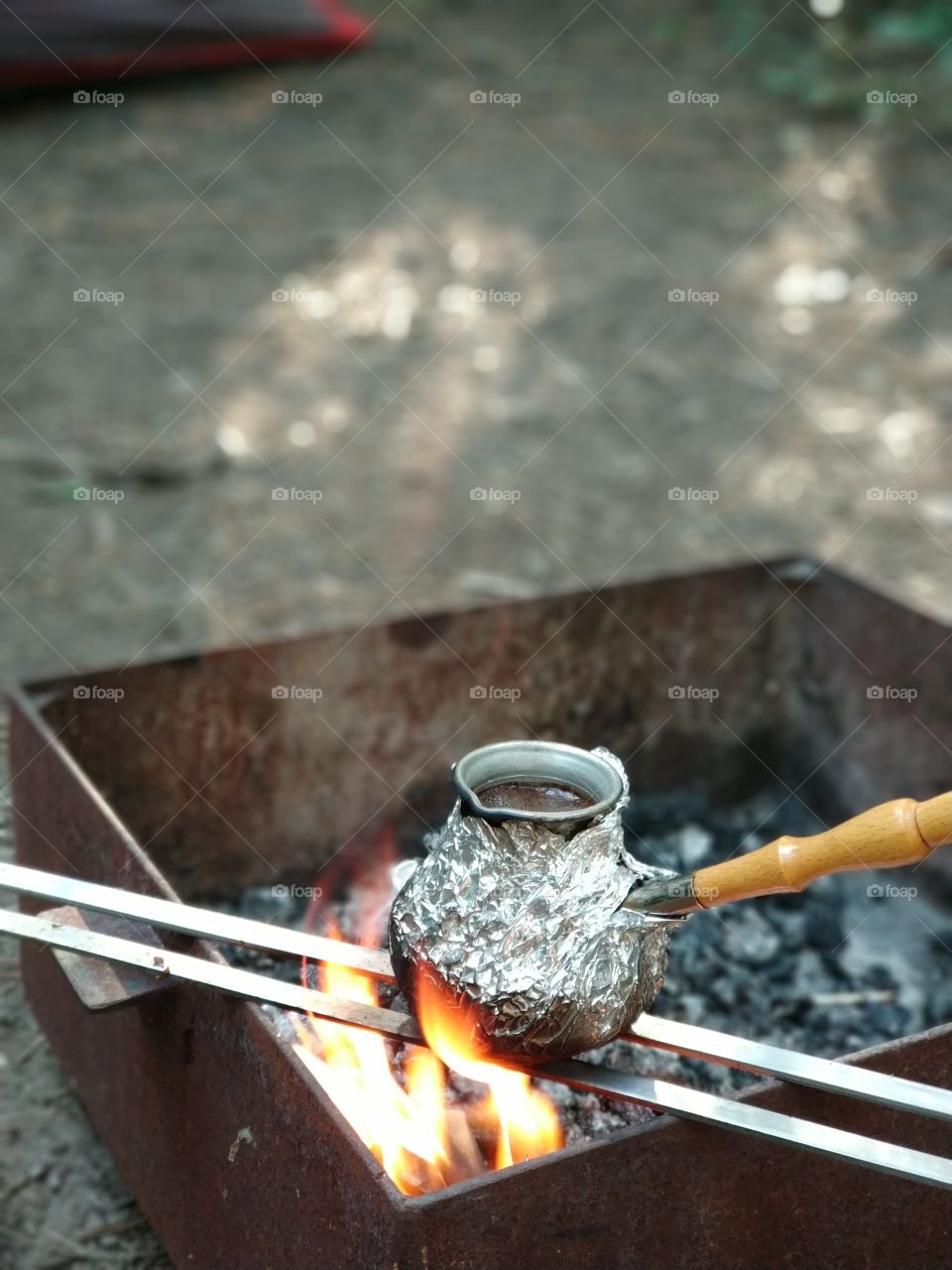 cooking out coffee over a fire