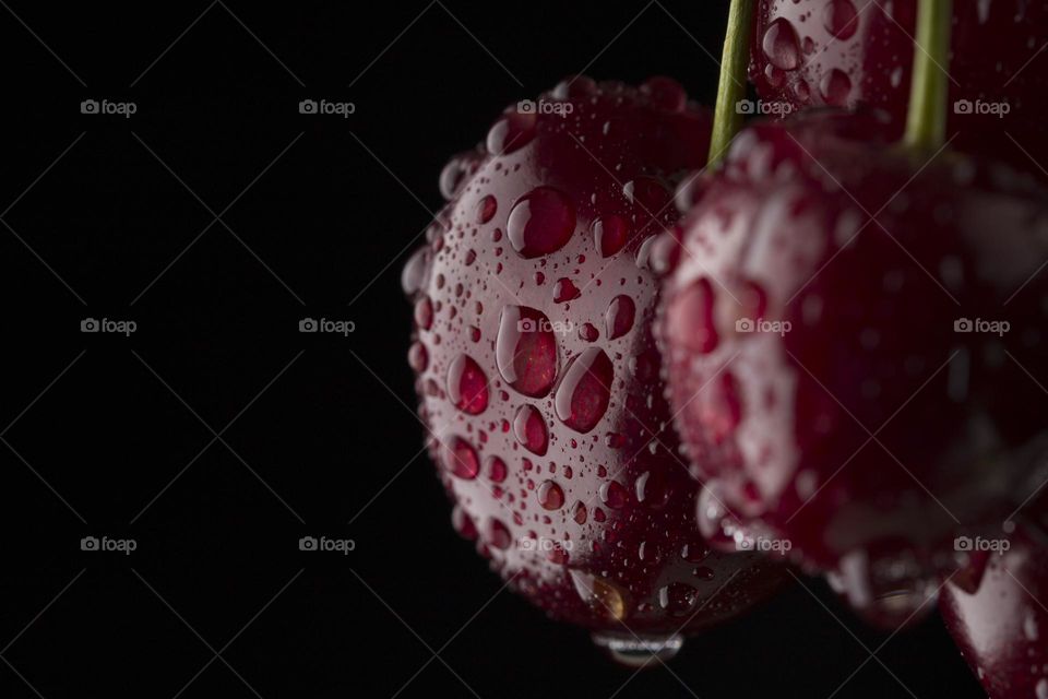 Cherry berries macro shot on black background