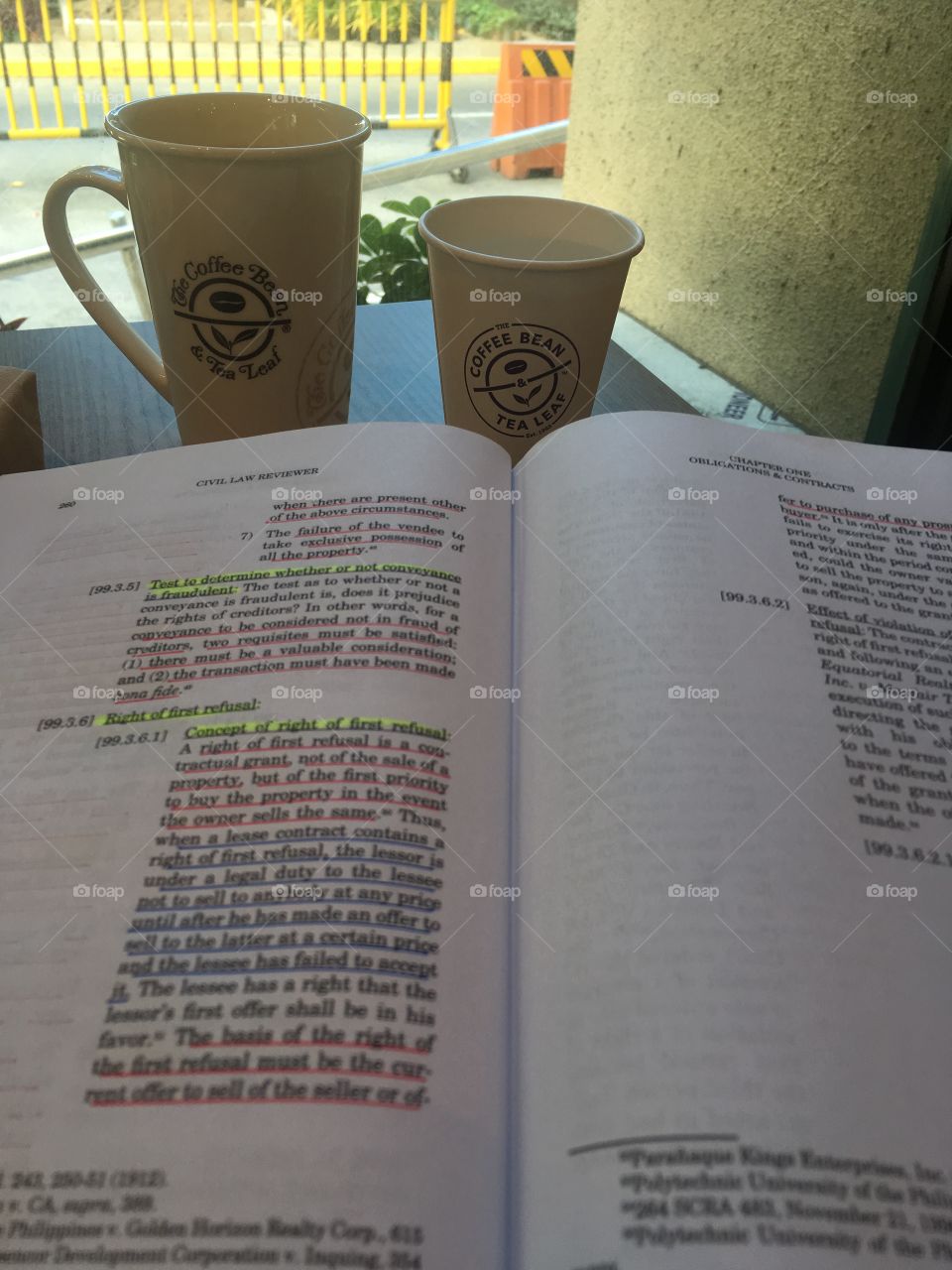 Studying a book with a cup of coffee