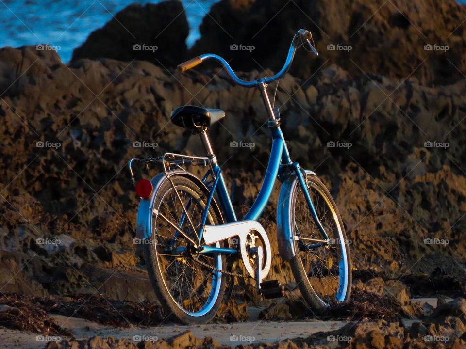 Bike on the beach at sunset